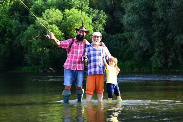 Family bonding. Father, son and grandfather fishing. Men day. Male multi generation family. Father, son and grandfather relaxing together. — Stock Photo, Image