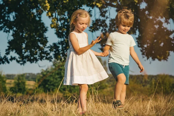 Eco living. Son and daughter planting on ground. sweet childhood. Little farmer in village. Active children concept. Summer leisure. Childhood on countryside.