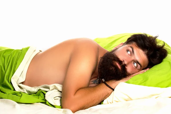 Man sleeping on pillow in bed at home. Sleep disorders concept. Young man sleeping on soft pillows in bed at home. — Stock Photo, Image