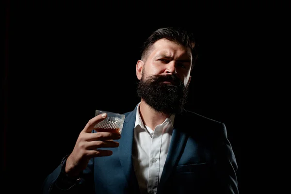 Alcoholism. Humans struggling with her bad habits. Serious unhappy sad man pouring vodka while having alcohol addiction. — Stock Photo, Image