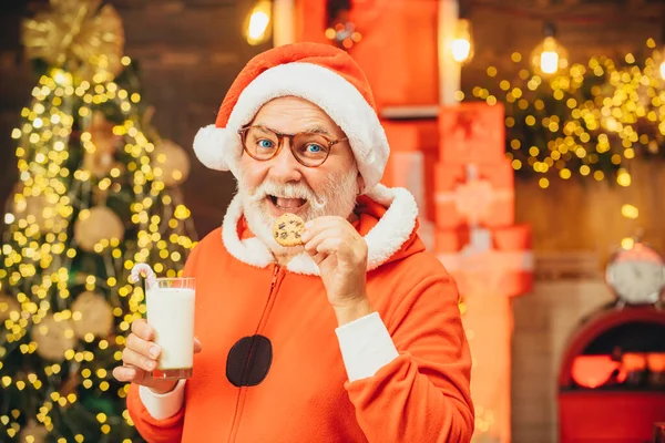 Santa Claus takes a cookie on Christmas Eve as a thank you gift for leaving presents. Happy new year. Merry Christmas. Christmas.