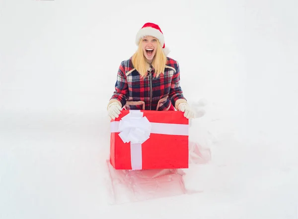 Funny girl push big gift box full length concept. Promotion and bonuses. Funny woman holding a big Christmas present. Give gift. Merry Christmas and Happy Holidays.