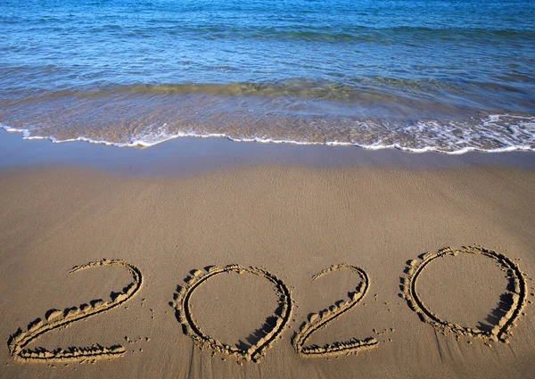 Sand beach drawing 2020. Happy New 2020 Year. Merry Christmas and Happy New Year. Background. Sea and sand beach. Copy space. Holidays. Background and textures concept.