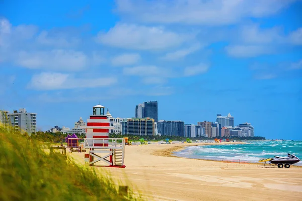 Miami South Beach lifeguard tower and coastline with cloud and blue sky. Lifeguard Post on Miami Beach.