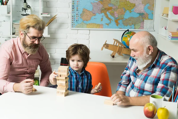 Happy man family concept laugh and have fun together. Generation of people and stages of growing up. Little boy enjoy time with elderly grandfather and young father.