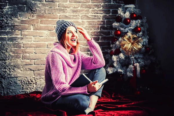 Sensual Christmas girl. Woman happy at home. Christmas time. Merry Christmas and Happy New Year happiness concept.