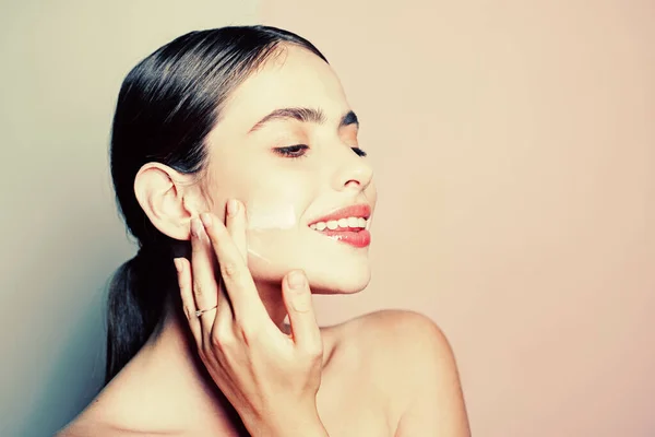 Facial care for female. Keep skin hydrated regularly moisturizing cream. Fresh healthy skin concept. Taking good care of her skin. Beautiful woman spreading cream on her face. Skin cream concept — Stock Photo, Image