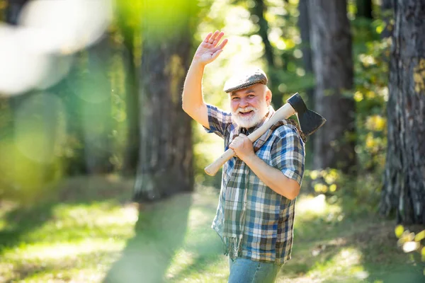 Old bearded man outdoors. Guy in forest. Funny man with beard. Happy man with beard and mustache hold axe. Hiking in deep wood. Old bearded forester. — Stock Photo, Image