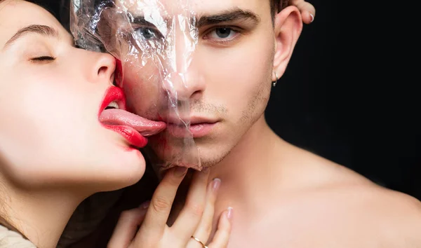 Health protection. Sexually transmitted diseases. Sexual activity. Sex health. Safety measures. Couple kissing through transparent plastic. Girl sexy tongue lick guy. Safe sex. Protecting health — Stock Photo, Image