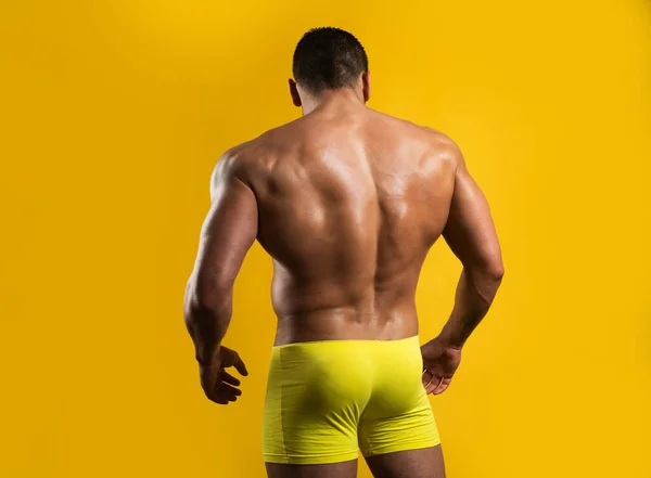 Male buttocks. Muscular back. Strong backside. Mens ass and powerful shoulders. Manliness booty buttocks. Sexy man with muscular body and bare torso. — 스톡 사진