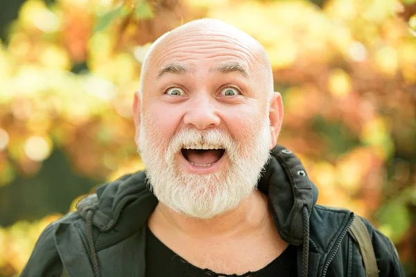 Senior man excited in autumn fandscape, close up portrait. — Stock fotografie