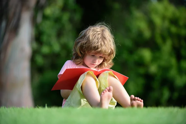 Kid learning to write, Preschool pupil education. Outdoor children education. Child distance learning using pencil to practice writing on a book.