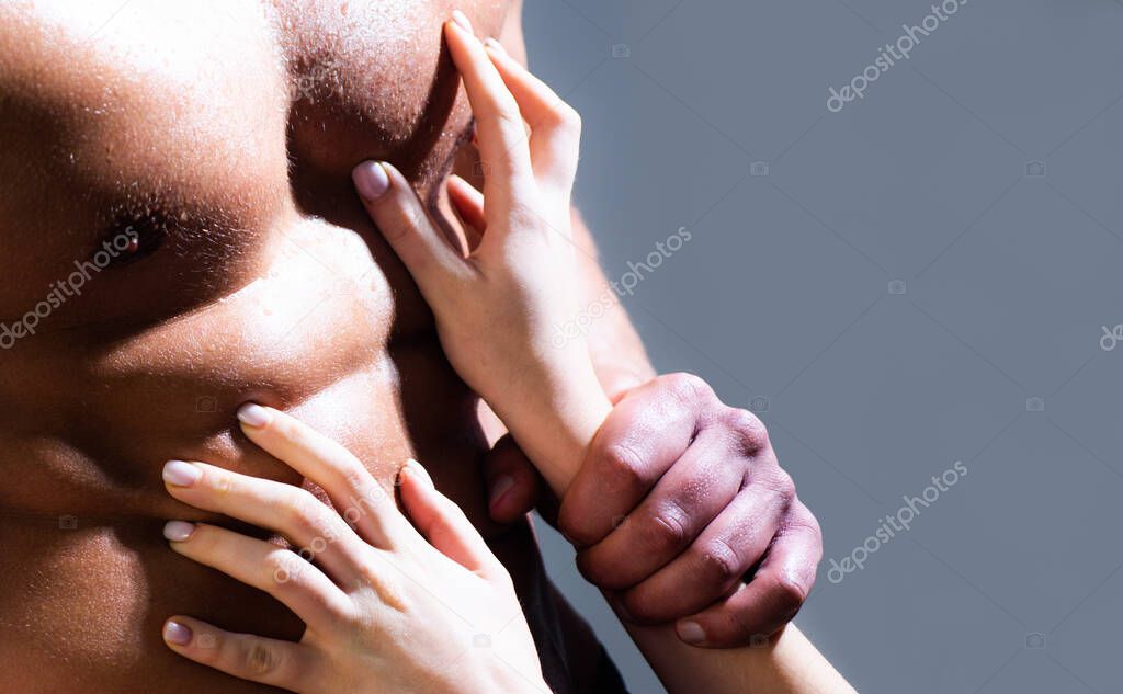 Undressed couple in love hugging passionately. Sexy seduction. Naked body, womans hand touch nude mans torso. Romantic tender. Erotic people concept.