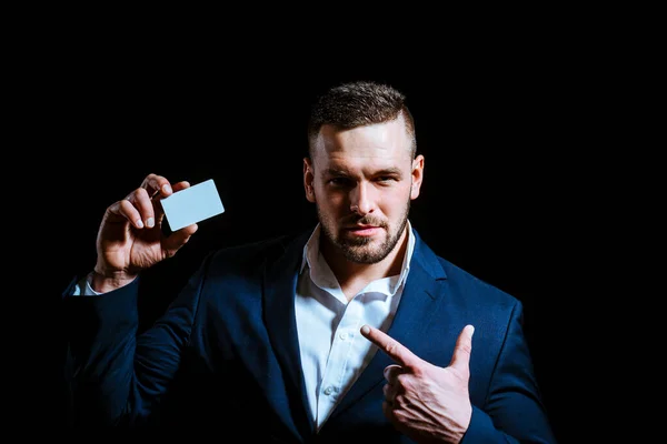 Business man in suit holding credit card. — Stock Photo, Image