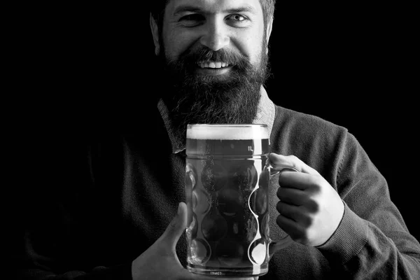 Retro man with a beer. Man holding mug of beer. The celebration oktoberfest festival concept. Beer in Germany.