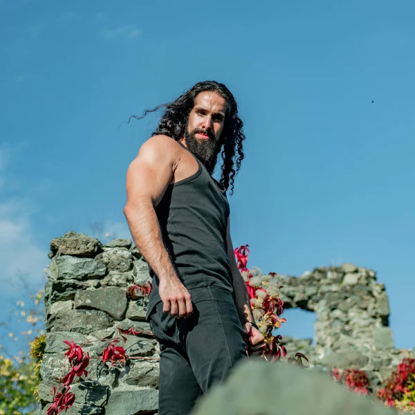 Young handsome man with long beard, mustache and trendy hairdo. — Stock Photo, Image