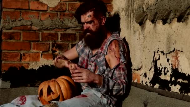 Slow motion. Horrible scary zombie man on the ruins of an old house. Horror. Halloween. — Stock Video