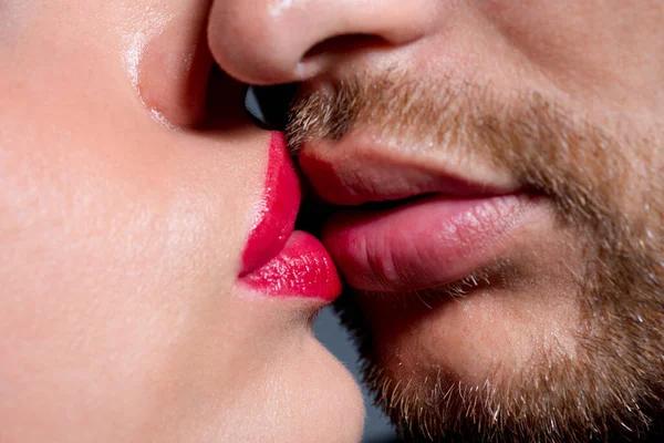 Kiss . Sexy couple In Love. Intimate relations. Close-up mouths kissing. Passion and sensual touch. Romantic man with woman lips kisses. Lovely people dating. Valentine Day. Cropped macro beauty face. Stock Photo