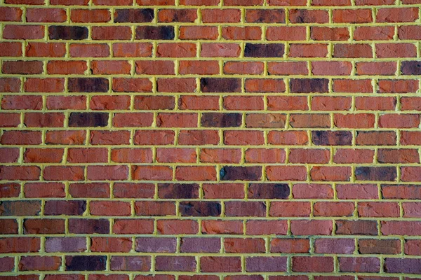 Tuğla tuğla duvar, kaliteli kumaş. İnşaat temaları için kırmızı tuğla duvar. Tuğla duvar arka planı. Tasarım projeleri için desenli tuğlalar. Katı tuğlalar, duvar yapısı yakın plan. Tuğla duvar deseni