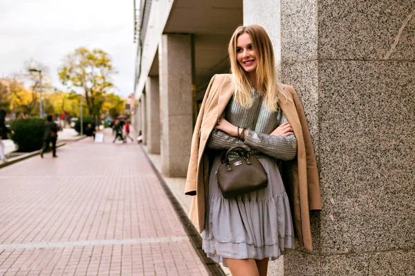 young woman  smiling on urban background in city