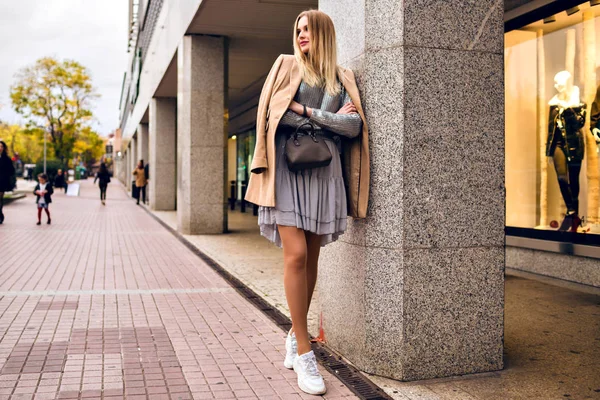 young woman  smiling on urban background in city