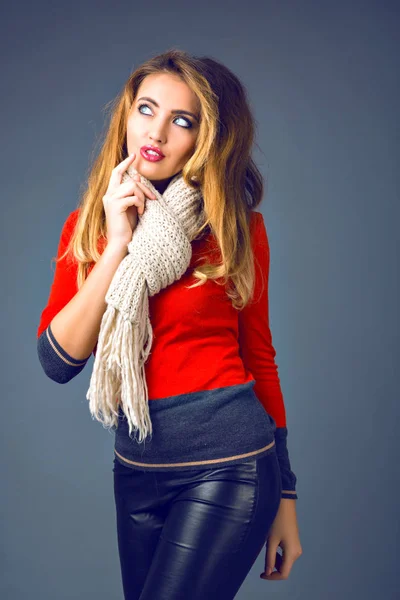 young beautiful woman in scarf posing in studio