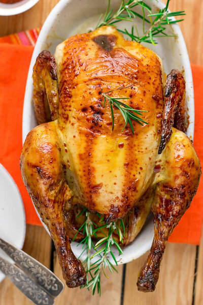 Oven baked sweet-and-sour crispy roast chicken served with rosemary