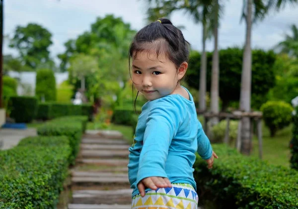 Cute Young Asian Girl Bright Blue Shirt Strolling Park Stone — Stock Photo, Image