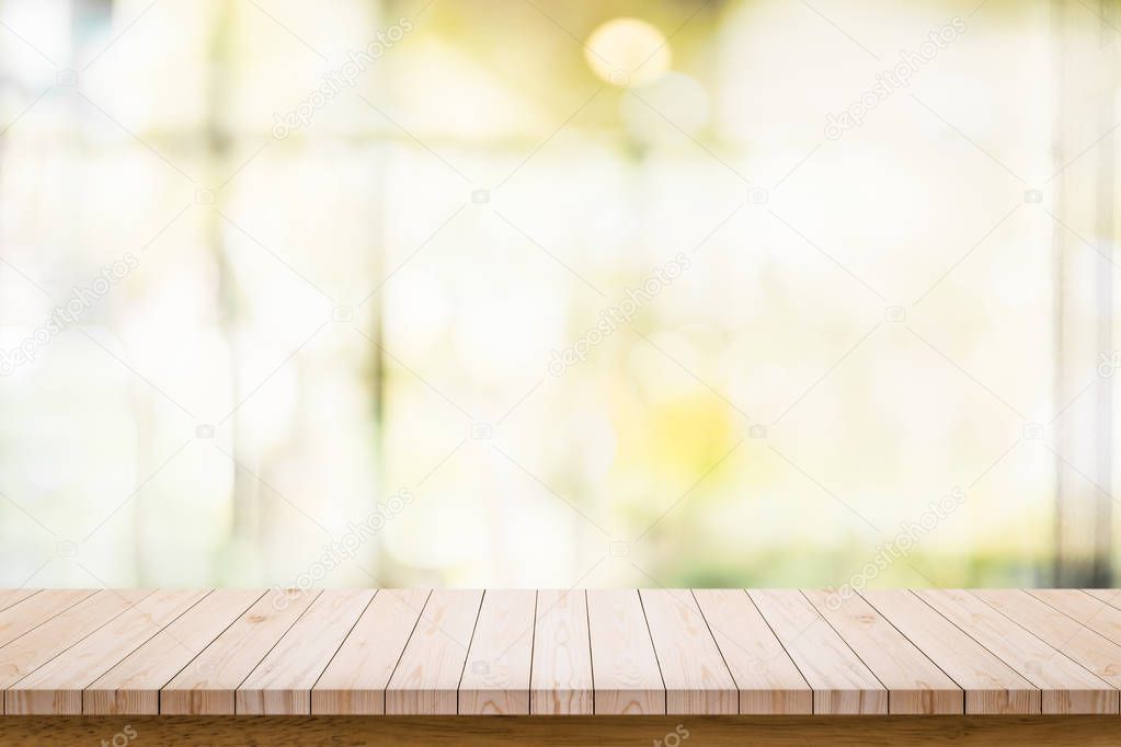 Empty wooden table with blur living room interior background.