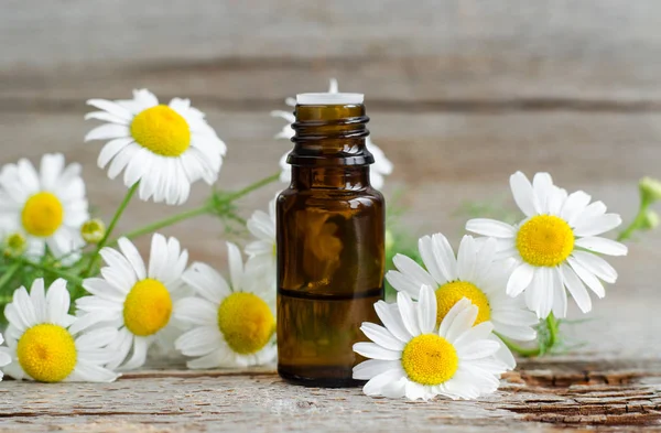 Small Glass Bottle Essential Roman Chamomile Oil Old Wooden Background — Stock Photo, Image