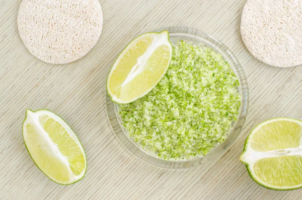 Homemade face and body lime scrub with lime zest and juice, sea salt and olive oil. DIY beauty treatments and spa recipe. Top view, copy space. — Stock Photo, Image