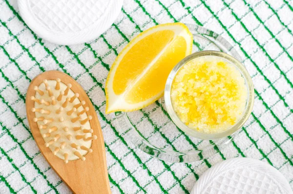 Homemade scrub (foot soak or bath salt) with lemon juice and zest, sea salt and olive oil. DIY beauty treatments and spa recipe. Top view, copy space