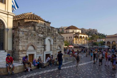 ATHENS, GREECE - AUGUST 12 2016:Monastiraki square in Athens, with Tzistarakis mosque and people around clipart