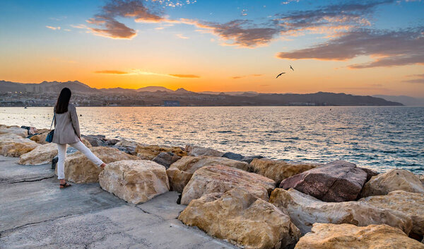 Sunset on walking stone pier at the Red Sea, Middle East