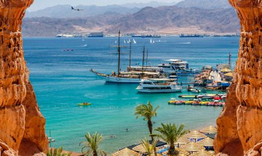 Central public beach in Eilat - Israeli southernmost and famous resort tourist city, located on the northern shores of the Red Sea clipart