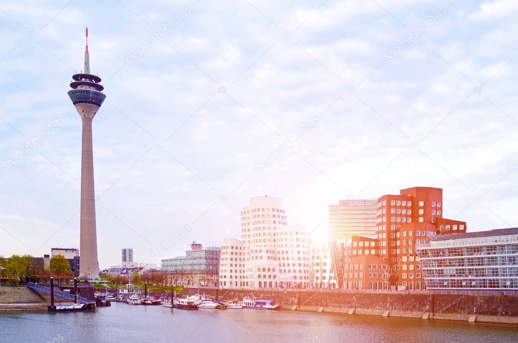Media harbor with futuristic buildings and tower in Dusseldorf, Germany
