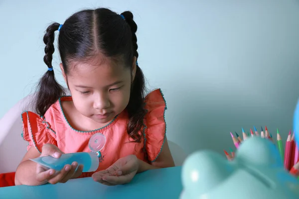 Asian Little Girl Using Alcohol Gel Cleaning Hands Protection Virus Stock Picture