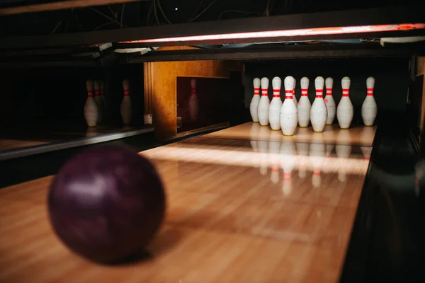 Bowling alley with pins and a ball