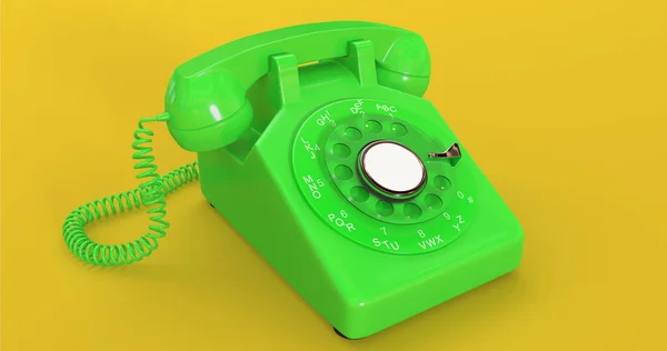 黄色背景的绿色老式旋转电话回转拨号铁丝电话带有接收机的老式电话 — 图库照片