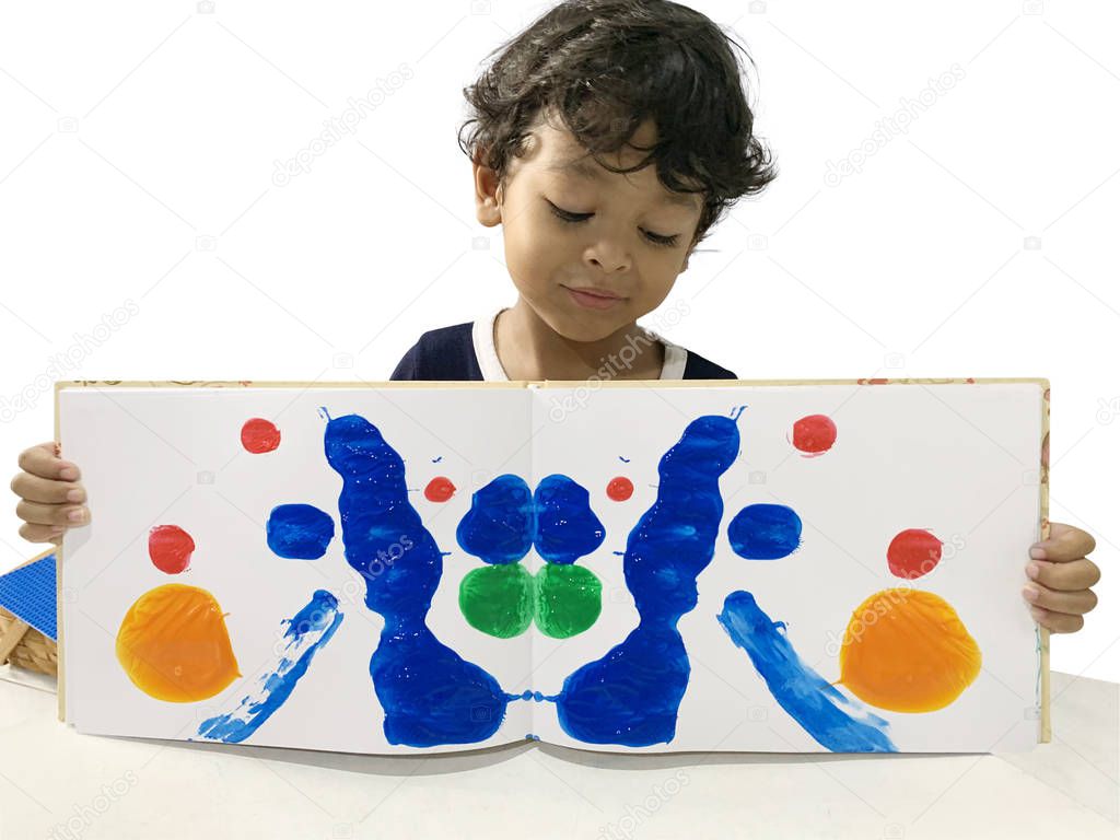 Asian boys are showing art from using paint on the book 
