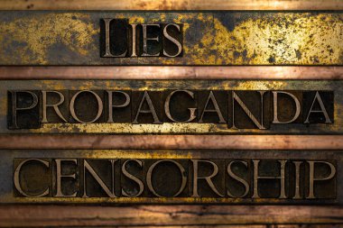 Lies Propaganda Censorship text formed with real authentic typeset letters on vintage textured silver grunge copper and gold background clipart