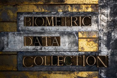 Biometric Data Collection text message on textured grunge copper and vintage gold background clipart