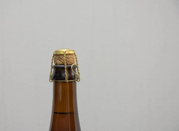 The top of a beer bottle with Crown Cap