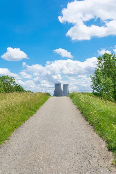 The road will bring you to the cooling towers of the nuclear power plant of Doel in Belgium