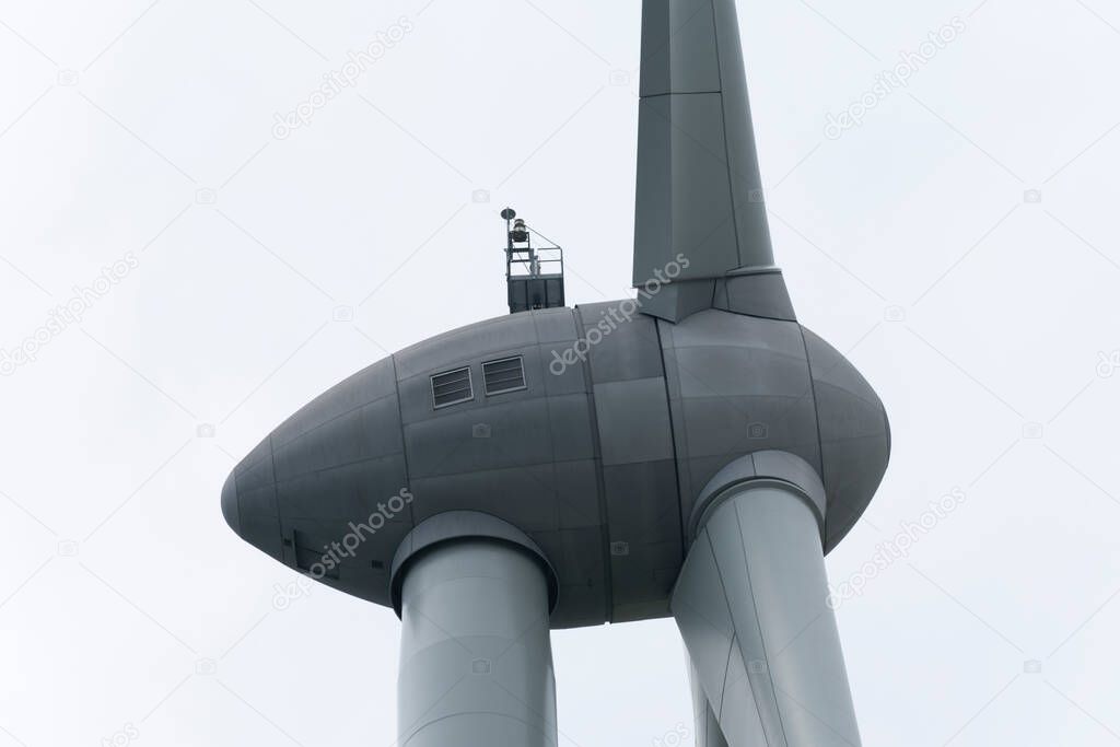 close up of the engine of a windmill with a white background
