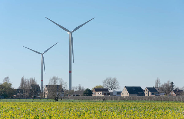Sint Gillis Waas, Belgium, March 22, 2020, Wind turbines on the edge of a residential area