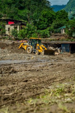 September18th2025 Dehradun Uttarakhand, India. Heavy machines remove rubble in Sahastradhara village after cloudburst floods Badli river, rescue teams search for missing.