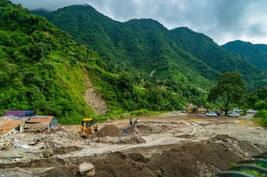 September18th2025 Dehradun Uttarakhand, India. Heavy machines remove rubble in Sahastradhara village after cloudburst floods Badli river, rescue teams search for missing.