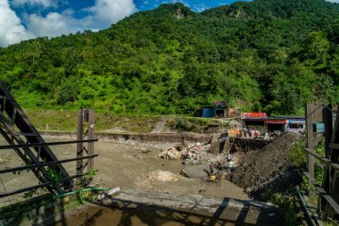 September18th2025 Dehradun Uttarakhand, India. Half of bridge swept away in Sahastradhara village as flash floods hit Badli river; rescue teams search amid debris and destruction.