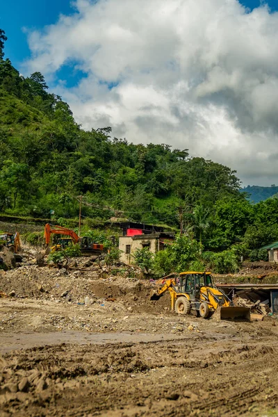 September18th2025 Dehradun Uttarakhand, India. Heavy machines remove rubble in Sahastradhara village after cloudburst floods Badli river, rescue teams search for missing.